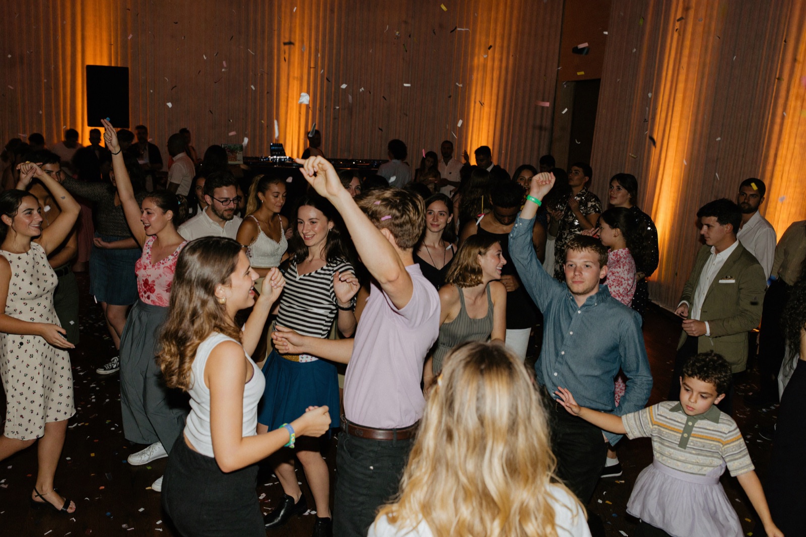 Bar mitzvah celebration in a Bal Harbour ballroom with guests dancing under event lighting