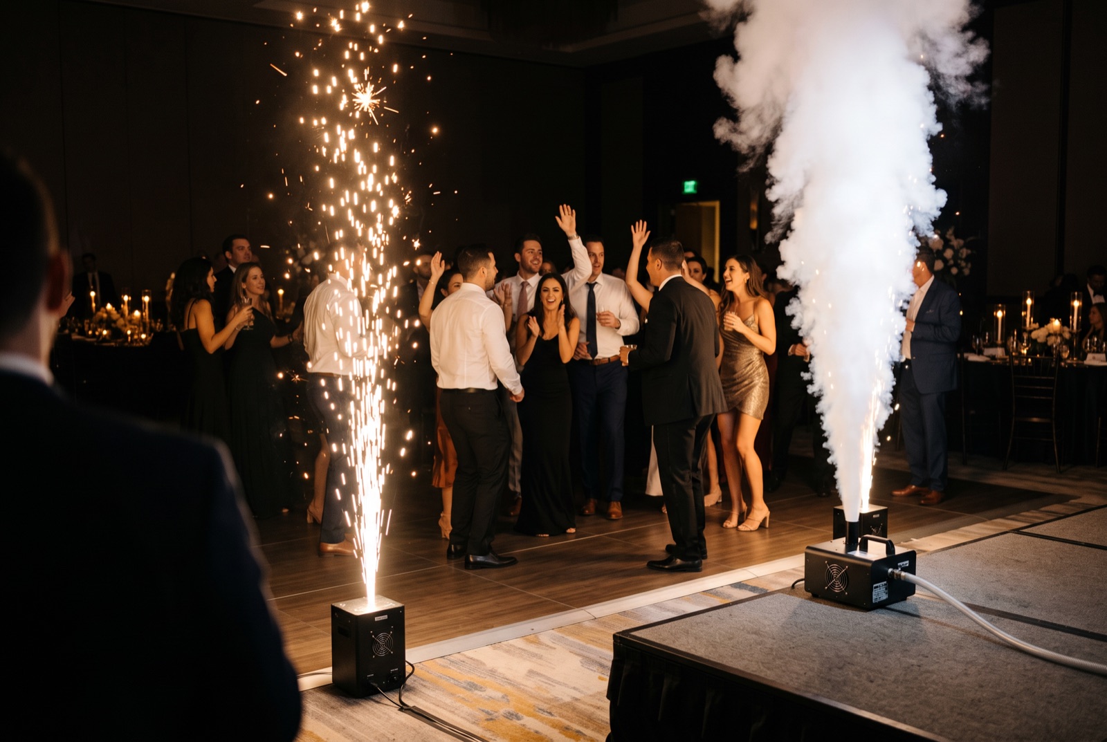 Cold spark fountain and CO2 jet firing side by side at a Miami reception, showing the difference between the two effects