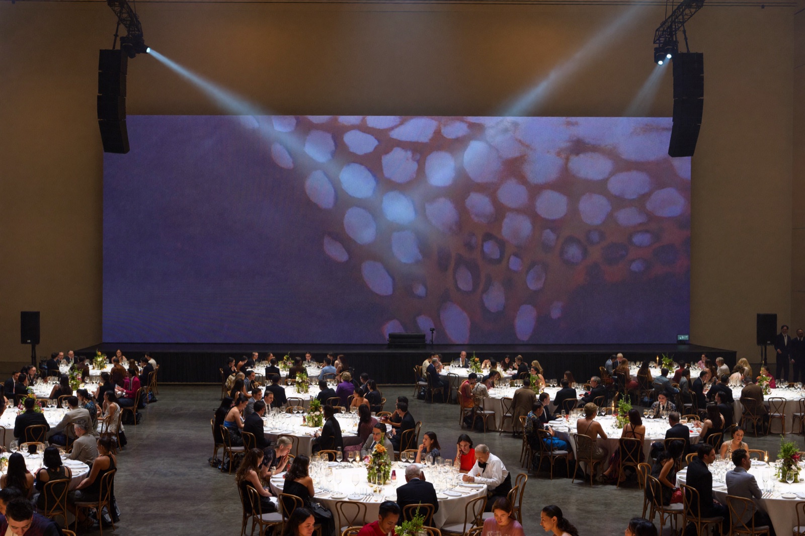 Stage and audience lighting at a corporate gala in a Miami convention center