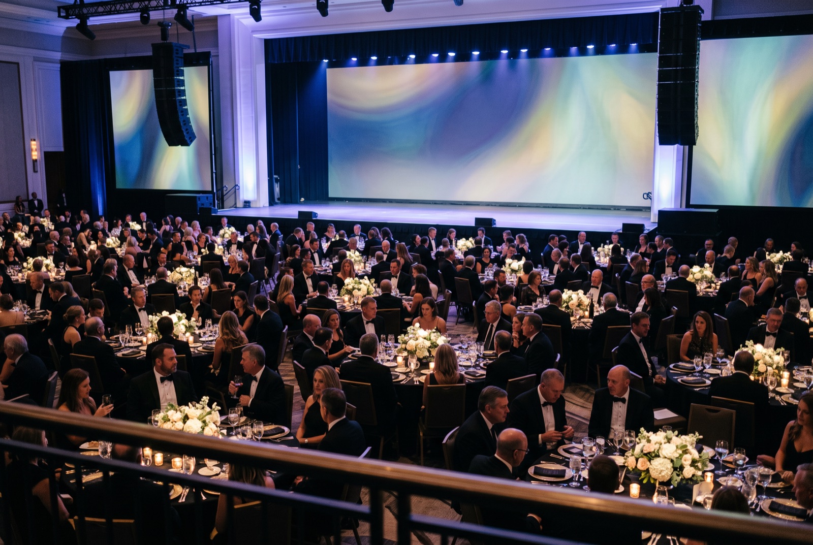 Corporate gala in full production with stage lighting and audience lighting at a Miami venue