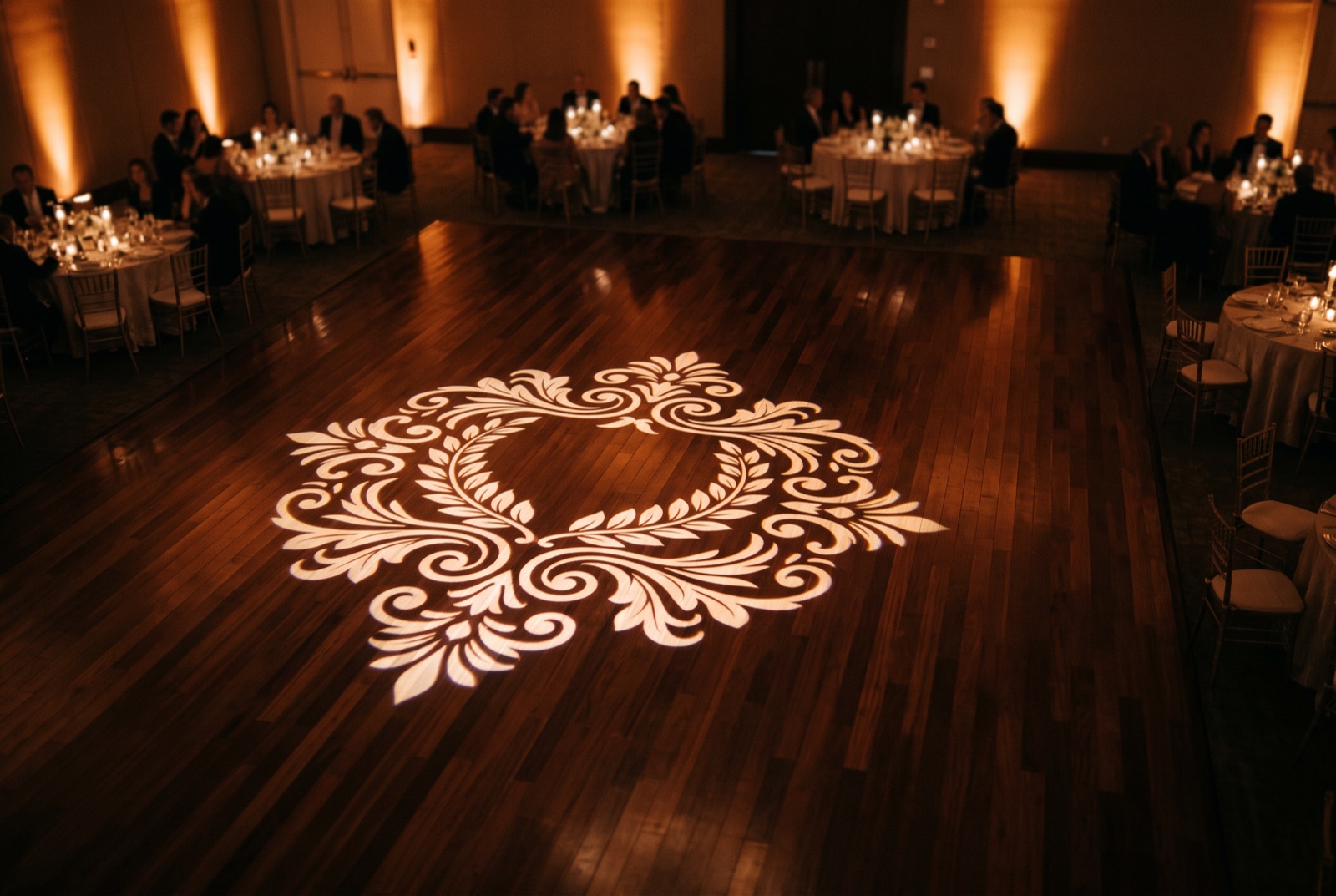 Monogram gobo projected onto the wall of a Miami ballroom during a reception