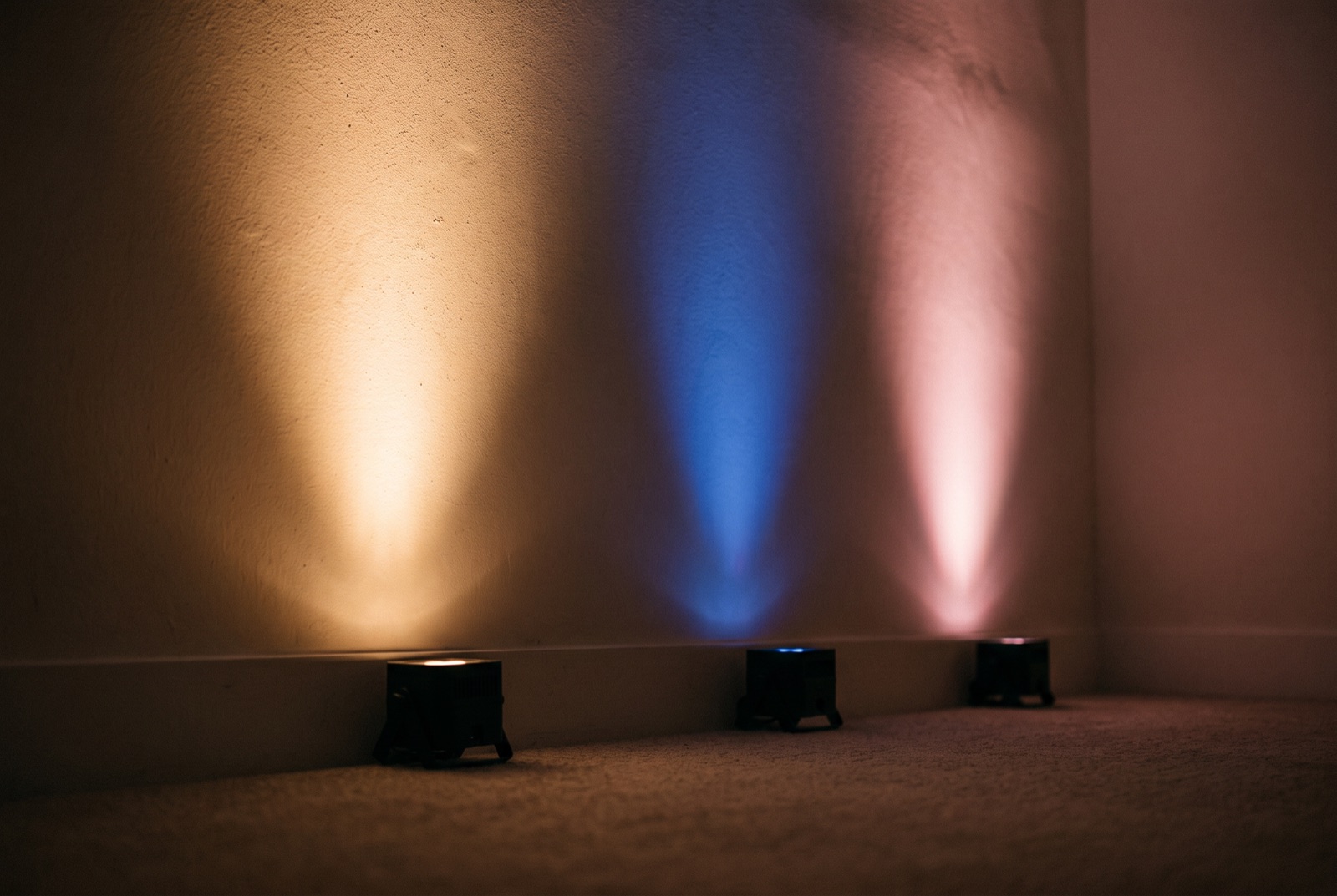 Wedding uplighting color options washing a Miami ballroom wall