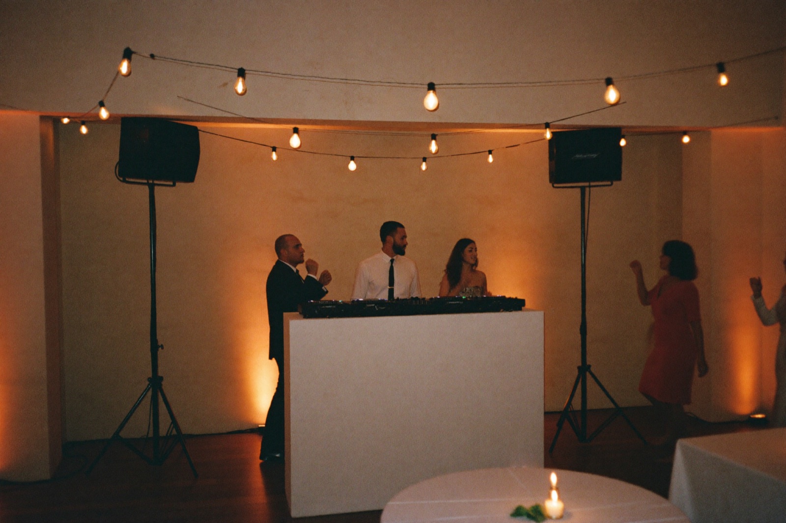 Wedding DJ setup with speakers and uplighting at a Miami reception